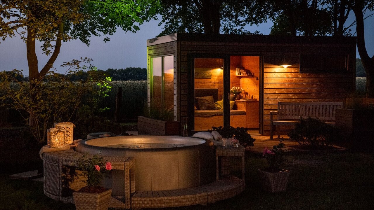 Outdoor Sauna with Softub spa by night