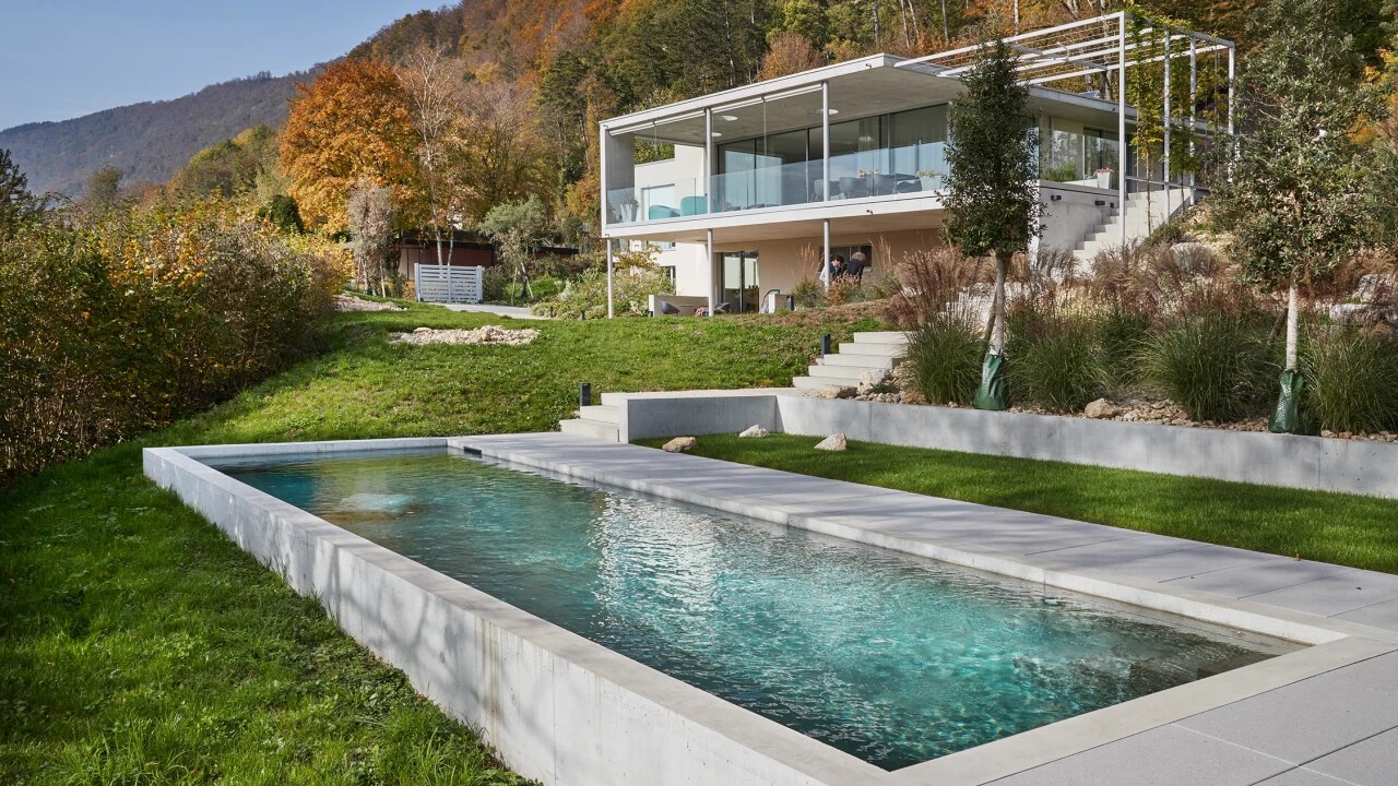 Avant-garde concrete pool in naturally idyllic surroundings