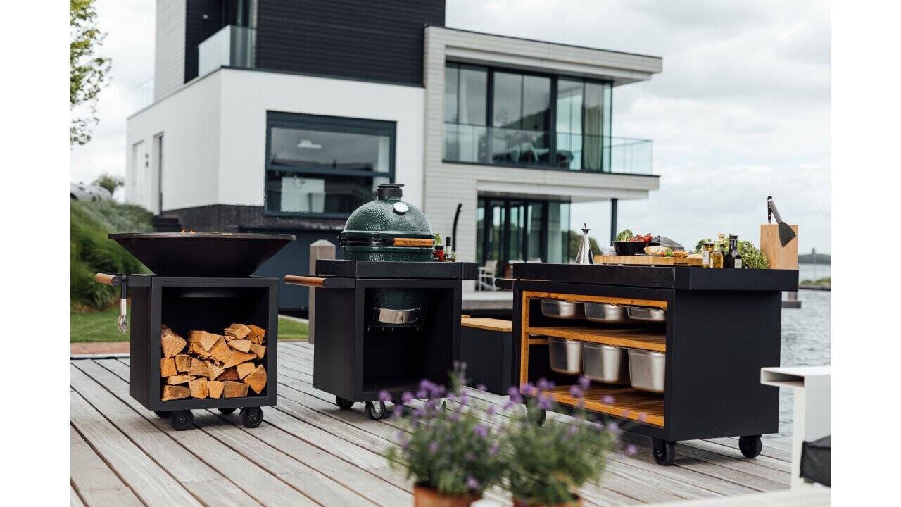 The Big Green Egg in the OFYR furniture program - with an OFYR fire bowl.