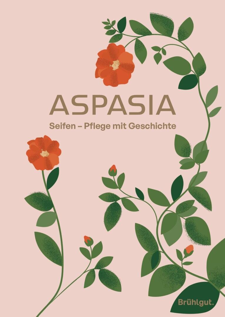 Illustrated red flowers and green tendrils surround the text "ASPASIA soaps - care with history" on a light pink background. The Brühlgut logo is in the bottom right-hand corner.