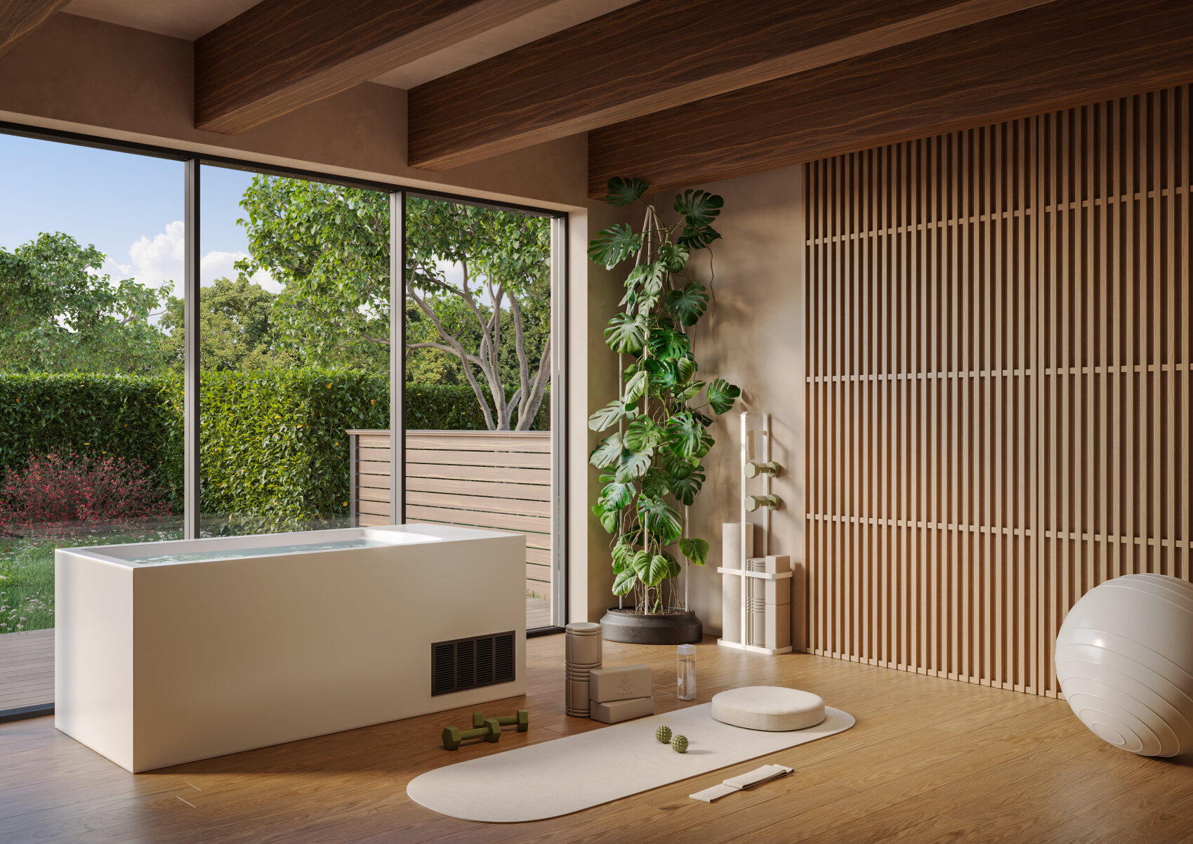 A modern, quiet gym with wooden floors, yoga mat, exercise ball, weights, potted plants and a bathtub in front of large windows overlooking a lush green garden.